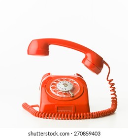 Closeup Of Red Vintage Phone Ringing, Isolated On White Background