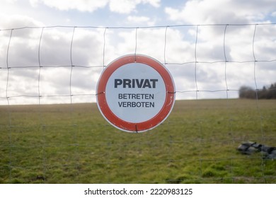 Close-up Of A Red And White Sign With The Inscription 