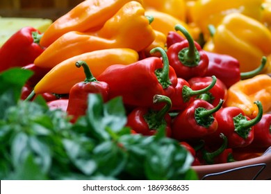 Close-up of red, yellow, and green peppers in a bowl