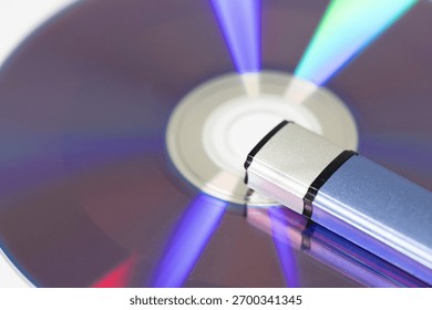 Close-up of Reflective CD and USB Flash Drive