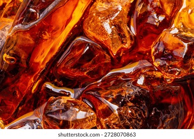 Close-up of Refreshing Cola with Ice Cubes Background,Top view close-up of dark brown cola or soda with sparkling ice cubes. High angle macro shot of refreshing cold beverage with bubbles and liquid.
