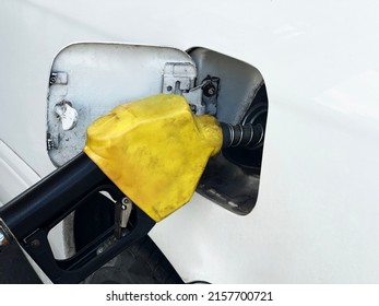 Close-up, Refueling The Car At The Gas Station, White Car Body