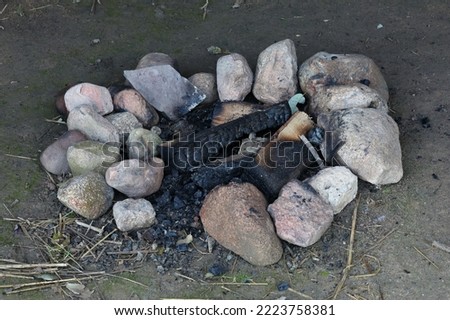 A close-up of the remains of a camp fire
