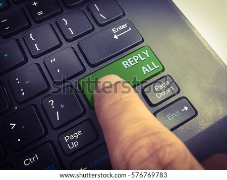 Close-up REPLY ALL button on the keyboard and have GREEN color button isolate black keyboard.