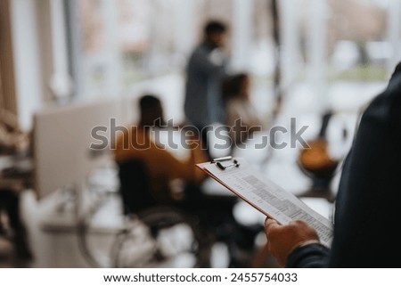 Close-up of a restaurant menu held by a person with a unfocused view of guests dining in the background, capturing the ambiance of a cozy eatery.