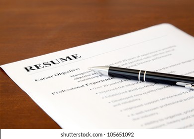 Closeup of Resume with Pen on the Table