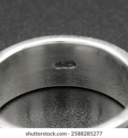 Close-up of the reverse side of a 925 silver ring, showcasing its hallmark and fine craftsmanship. Ideal for showcasing ring designs or promoting high-quality silver jewelry with authenticity