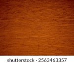 A close-up of a rich, dark brown wood grain pattern. The wood has a warm, reddish tone and exhibits a flowing, wavy grain.

