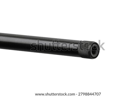 Close-up of a rifle barrel muzzle with a threaded protector isolated on white.