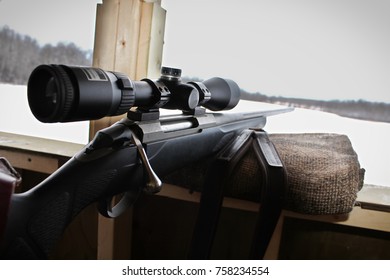 Closeup Of A Rifle Bolt And Scope While Hunting.