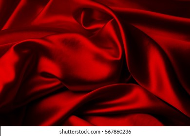 Closeup of ripples in red silk fabric