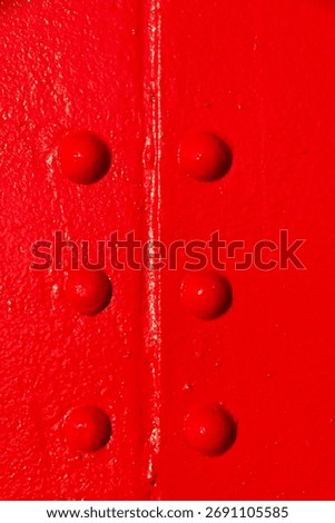 Closeup of rivets on red lighthouse in Grand Haven, Michigan, USA.