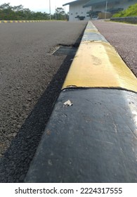 Close-up Of Road Boundary With Pedestrian Area