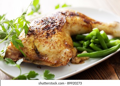 Closeup Of Roast Chicken And Oven Potatoes