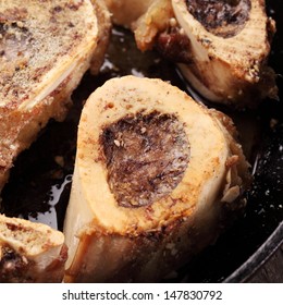 Close-up of roasted bones marrow in a pan