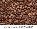 Close-up of roasted coffee beans forming a textured background. Perfect for concepts related to coffee production, brewing, café culture, or as a background for food and beverage themes.