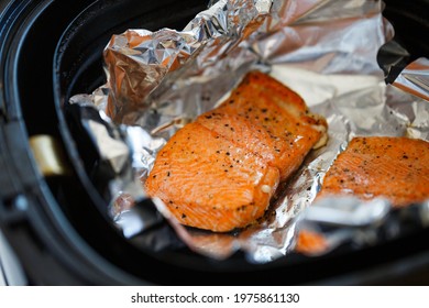 Closeup Of Roasted Salmon Steak With Salt And Pepper In An Air Fryer