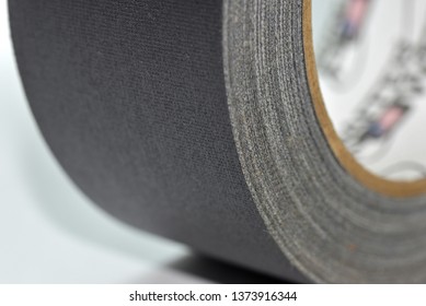 Closeup Of A Roll Of Black Gaffer Tape, Side View.