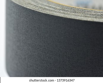 Closeup Of A Roll Of Black Gaffer Tape, Side View.