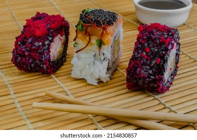 Close-up Roll With Flying Fish Caviar, On A Bamboo Mat