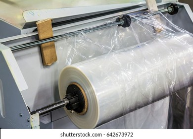 Closeup of a roll of polyethylene film for packing products at the confectionary plant 