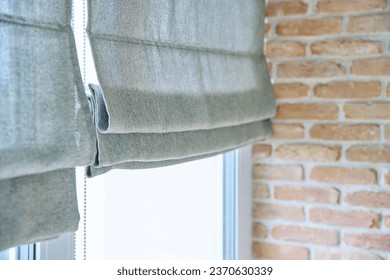 Close-up of roman blinds with gray linen fabric - Shutterstock ID 2370630339