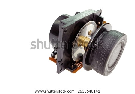 Close-up of a rotary encoder featuring a circuit board, and intricate mechanical components, set against a white backdrop