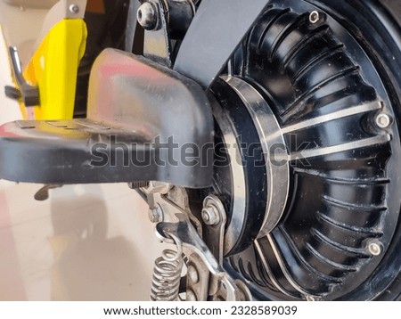 closeup of a rotating bicycle dynamo generating electricity as it rotates