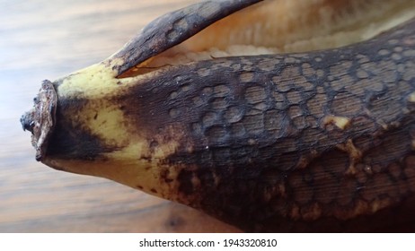 Closeup Of Rotten Banana Peel On Brown Wood Table