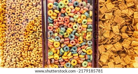 Closeup of a row of oat and fruity cereal at a continental breakfast