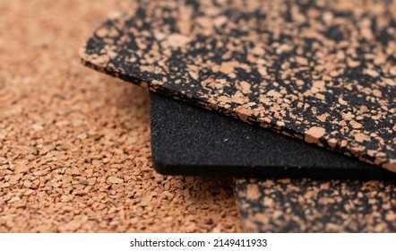 A close-up of a rubberized and rubberless cork plate with a shallow depth of field