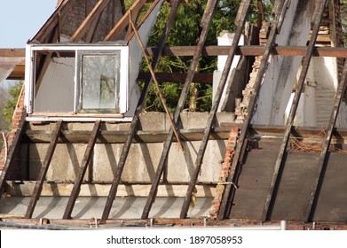 Closeup Of A Ruin Of A Farm With White Dormer