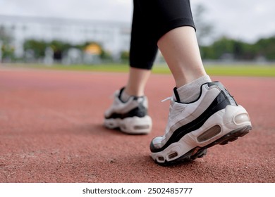 Close-up of Runner feet running at the stadium - Powered by Shutterstock