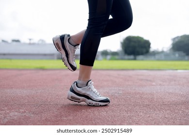 Close-up of Runner feet running at the stadium - Powered by Shutterstock