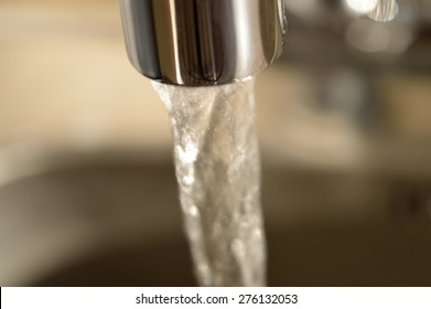 Close-up Of Running Water From A Faucet.