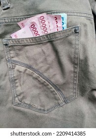 Closeup Of Rupiah Money In Faded Brown Jeans Pocket, Concept Of Having Money, Rich