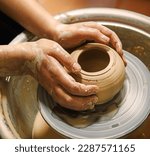 Closeup rural bible god male artisan worker dirty arm touch tool teach ancient retro old earthen culture water mug pitcher vessel ware. Rustic antique wet hobby table girl learn make pan dish design