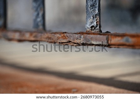 Closeup of rusted gate bar