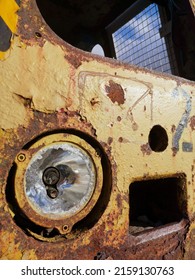 A Closeup Of A Rusted Train Headlight