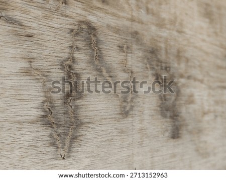 Close-up of rustic bleached wood texture with a distinct, natural zigzag grain pattern, perfect for backgrounds