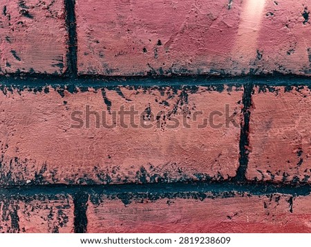 Close-up of a rustic red brick wall texture with distressed black mortar lines. This detailed background showcases weathered brickwork with a painted, textured surface and dark accents, creating an industrial, vintage, or grunge aesthetic. Perfect for architectural, construction, or abstract design backgrounds.