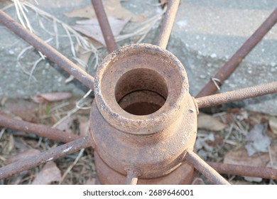 Closeup of a rustic rusting iron wagon wheel for decoration 