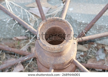 Closeup of a rustic rusting iron wagon wheel for decoration 