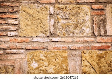 Close-up of a rustic stone and brick wall with irregular patterns and earthy tones. Aged masonry texture ideal for backgrounds, 3D rendering, or architecture themes - Powered by Shutterstock - Get 15% off with code: PIKWIZARD15