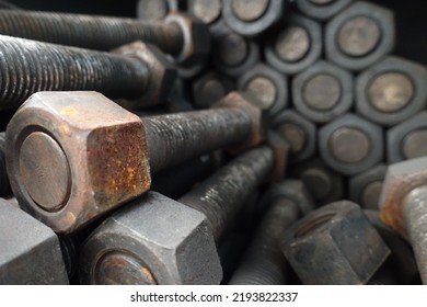 Closeup Rusty Bolts And Nuts In Organized Array Pattern, Arranged In Layers, Retro Industrial Concept, Industrial Background. Selected Focus