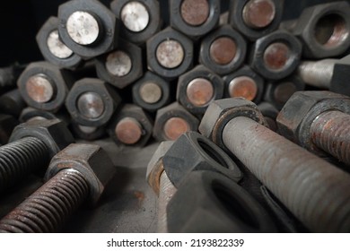 Closeup Rusty Bolts And Nuts In Organized Array Pattern, Arranged In Layers, Retro Industrial Concept, Industrial Background. Selected Focus