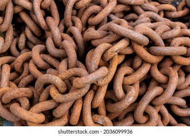 Close-up of rusty chain. Closeup of a bunch of rusty chains. Overhead shot of rusty metal chains in a bunch