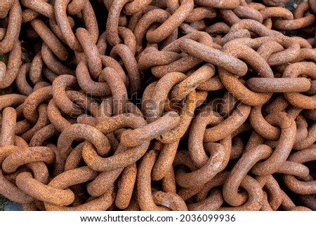Close-up of rusty chain. Closeup of a bunch of rusty chains. Overhead shot of rusty metal chains in a bunch