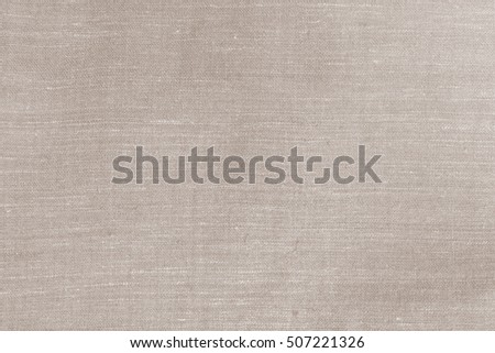 Close-up sackcloth woven texture pattern. Eco freindly handmade natural cotton, linen old fabric textile cloth in light brown vintage retro color for abstract background of book cover