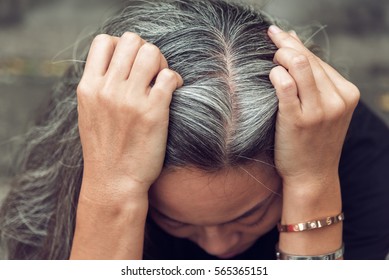 Closeup Sad Asian Young Beautiful Woman And Gray Hair With Worried Stressed Face Expression Looking Down